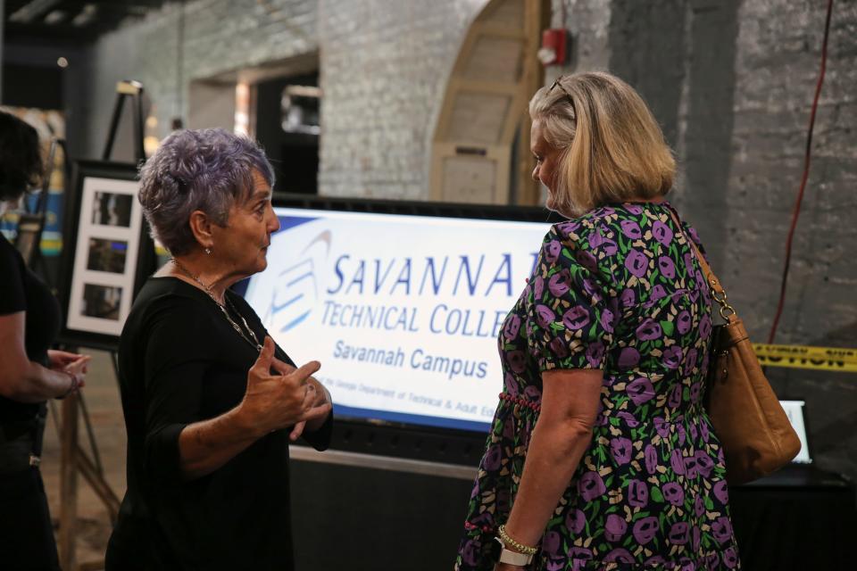 People look over plans at the Savannah Culinary Institute meeting on Thursday, June 2. The meeting was held to talk about what's new and what's next for the school as they plan construction on their new location on West Bay Street.
