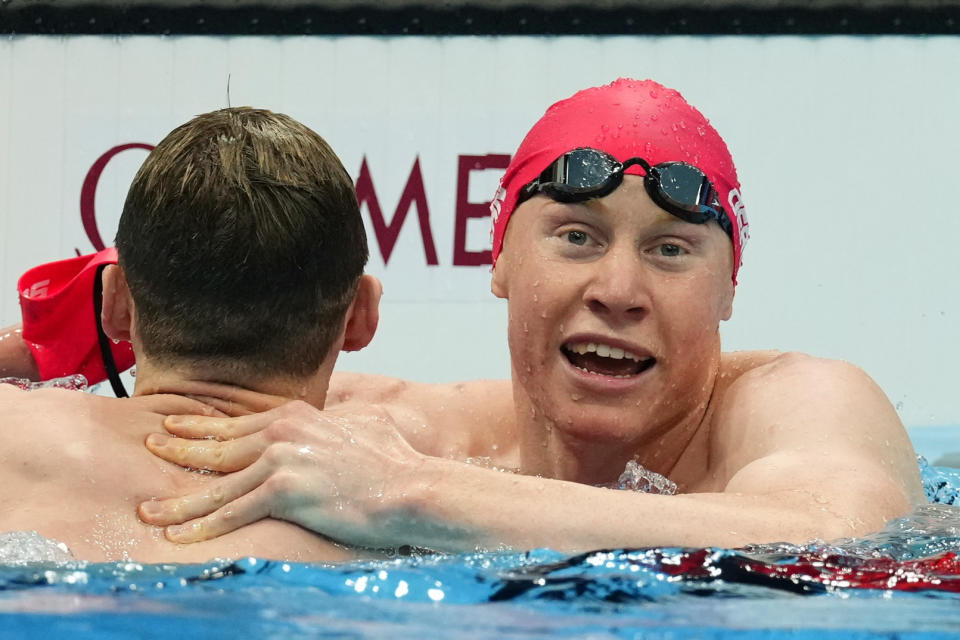 Tokyo 2020 Olympics - Swimming - Men's 200m Freestyle - Final - Tokyo Aquatics Centre - Tokyo, Japan - July 27, 2021. Tom Dean of Britain celebrates with Duncan Scott of Britain after winning the event REUTERS/Aleksandra Szmigiel