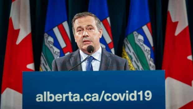 Alberta Premier Jason Kenney announced new public health measures last week — political scientists say that may have played a part in Monday's election results. (The Canadian Press - image credit)