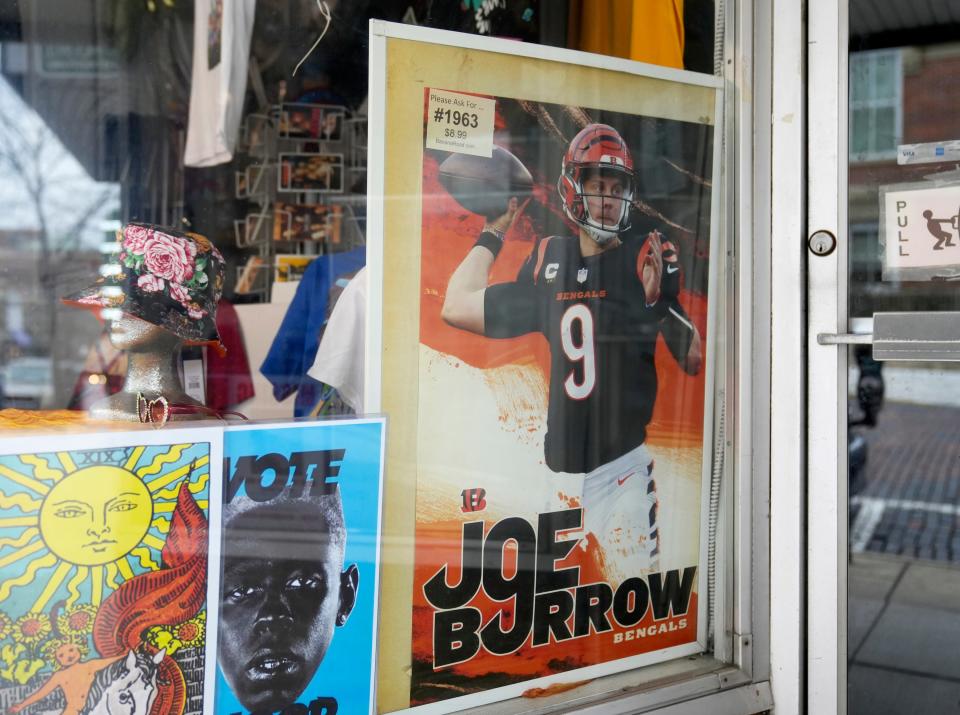 A poster of Cincinnati Bengals quarterback Joe Burrow, who grew up in the Athens area, hangs in the front window of Uptown Costumes.