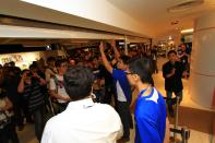 Customers waiting to enter the store at M1 Paragon