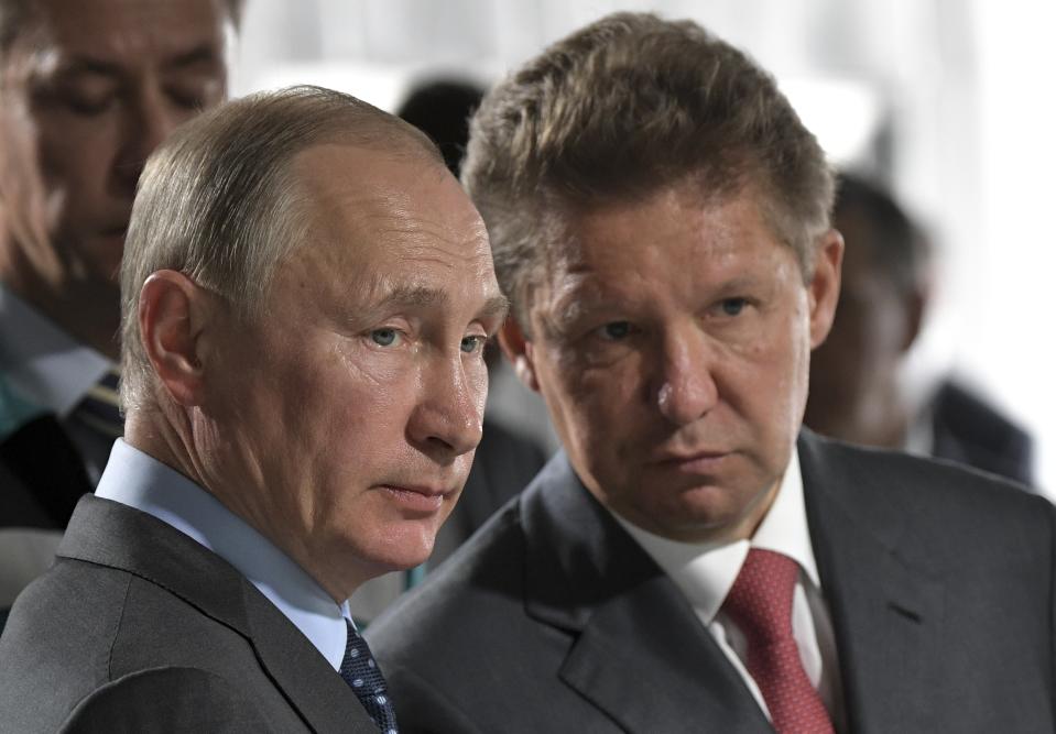 FILE - Russian President Vladimir Putin, left, and Alexei Miller, Russian natural gas giant Gazprom CEO, attend a meeting of major investment projects implementation in the Russian Far East as part of his trip to the Nizhne-Bureiskaya Hydroelectric Power Plant in Novobureyskiy, Russia, on Aug. 3, 2017. Europe is short of gas. Russia could in theory supply more beyond its long-term agreements, but hasn't, leading to accusations it is holding back to pressure Europe to approve a new controversial Russian pipeline. (Alexei Nikolsky, Sputnik, Kremlin Pool Photo via AP, File)