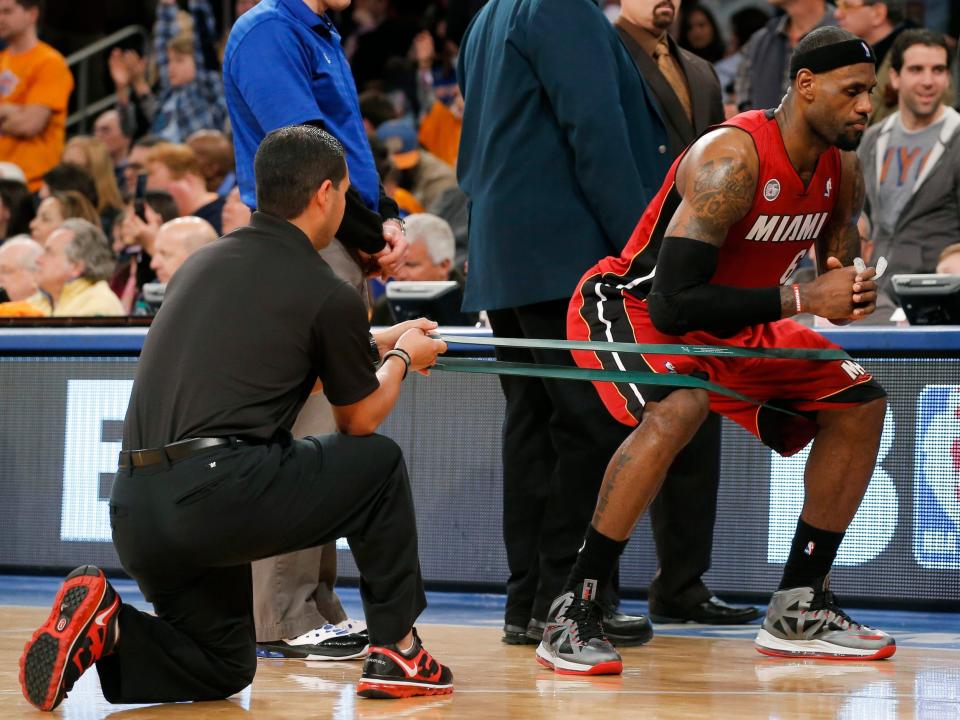 LeBron James exercising with bands.