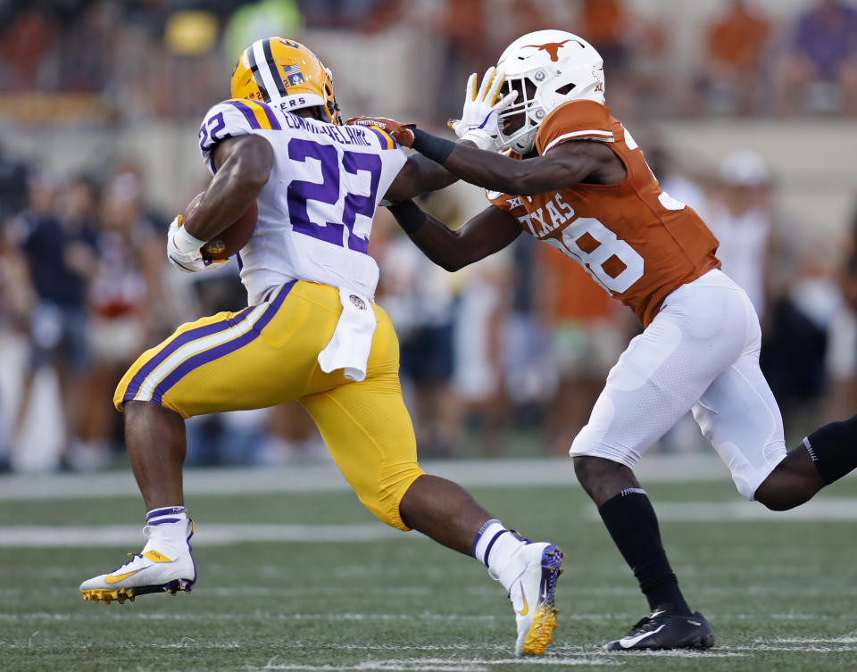 LSU Tigers running back Clyde Edwards-Helaire #22 tries to shake the tackle of Texas Longhorns defensive back Kobe Boyce #38, Saturday Sept. 7, 2019 at Darrell K Royal-Texas Memorial Stadium in Austin, Tx. ( Photo by Edward A. Ornelas )