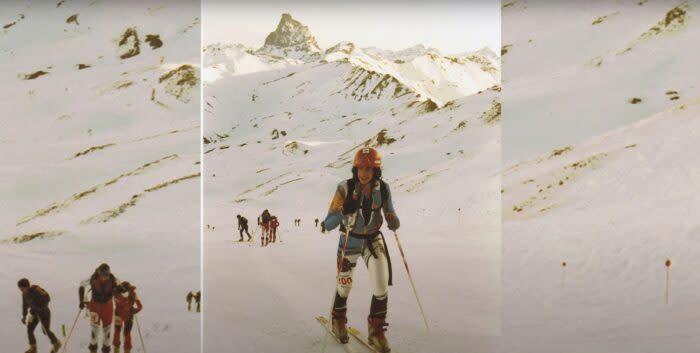 a photo of a young man in ski-mo gear with mountains in the background