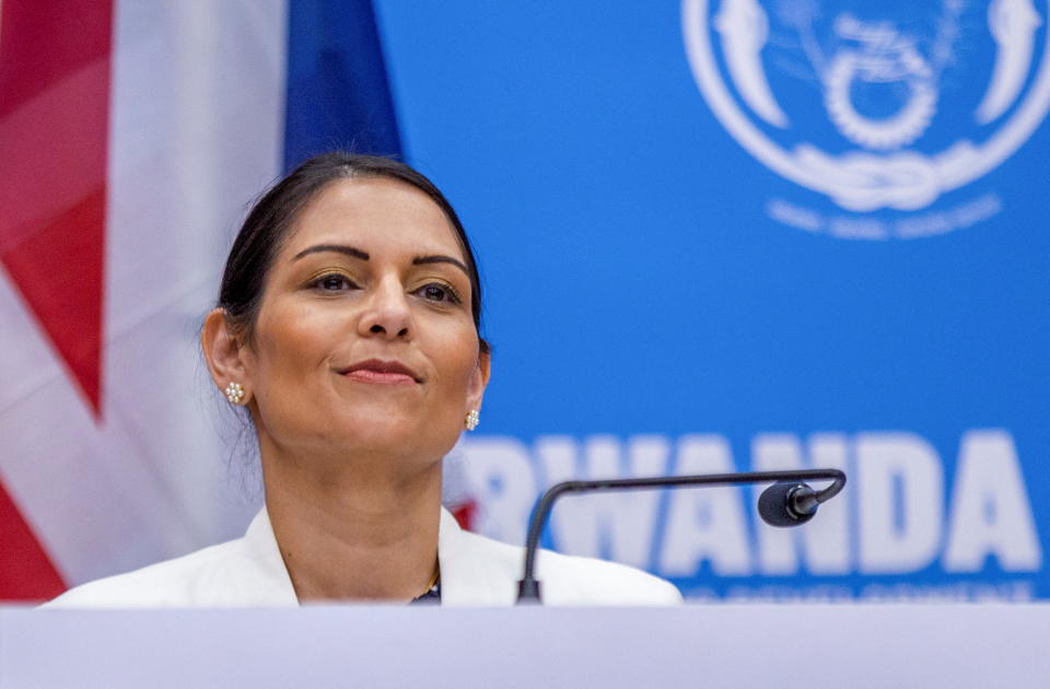 British Home Secretary Priti Patel addresses a joint news conference with Rwandan Foreign Minister Vincent Biruta, after signing the partnership agreement in Kigali, Rwanda, April 14, 2022. REUTERS/Jean Bizimana