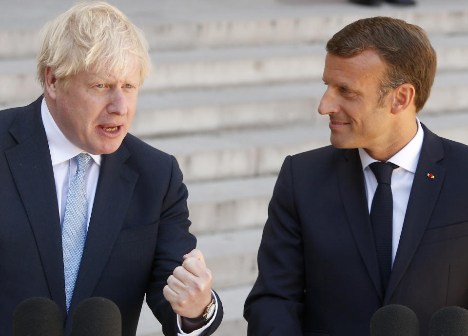 French President Emmanuel Macron, right, and Britain's Prime Minister Boris Johnson talk to the media at the Elysee Palace, Thursday, Aug. 22, 2019 in Paris. Boris Johnson traveled to Berlin Wednesday to meet with Chancellor Angela Merkel before heading to Paris to meet with French President Emmanuel Macron. (AP Photo/Michel Spingler)