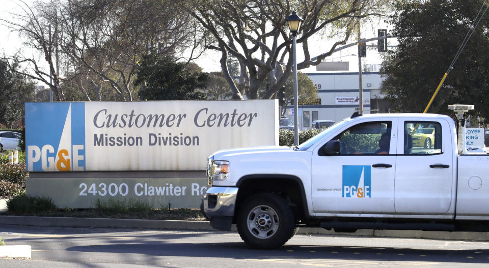 FILE -- In this Wednesday, Jan. 23, 2019, file photo, a Pacific Gas & Electric truck enters their customer center in Hayward, Calif. Gov. Gavin Newsom says PG&E plans to remake its board of directors with hedge fund financiers and people who have little experience in utility operations and safety. Newsom, on Thursday March 28, 2019, said putting hedge fund managers in charge of the company will send a message the utility prioritizes profits over providing safe and reliable energy service. The utility did not immediately comment. (AP Photo/Ben Margot, File)