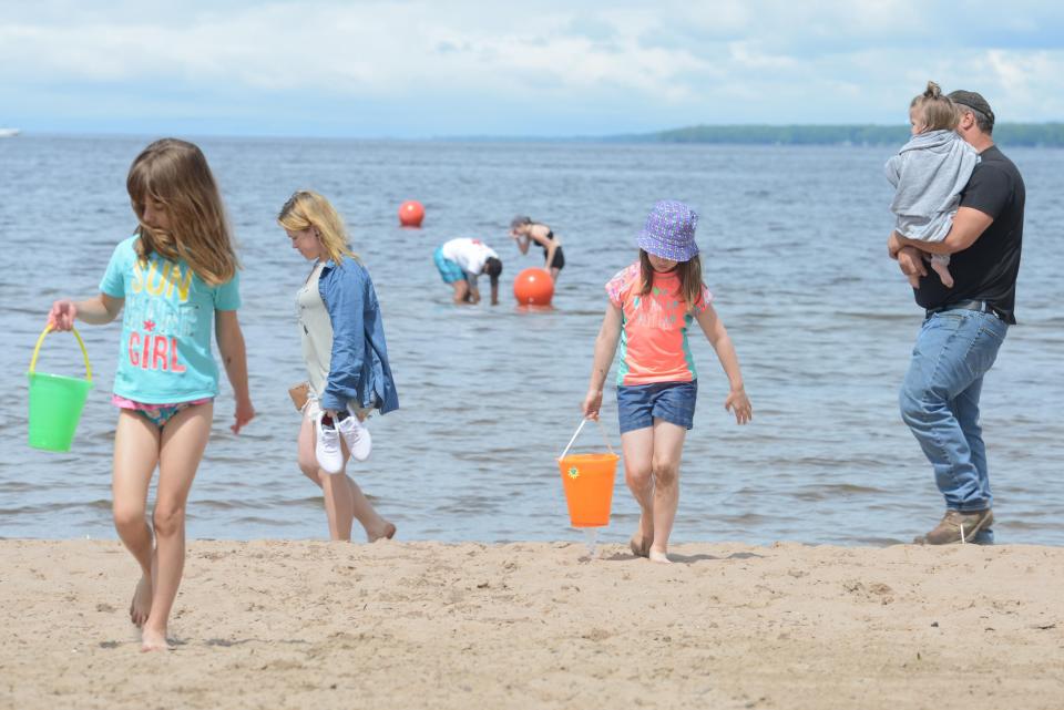 Beachgoers stay cool at Sylvan Beach.