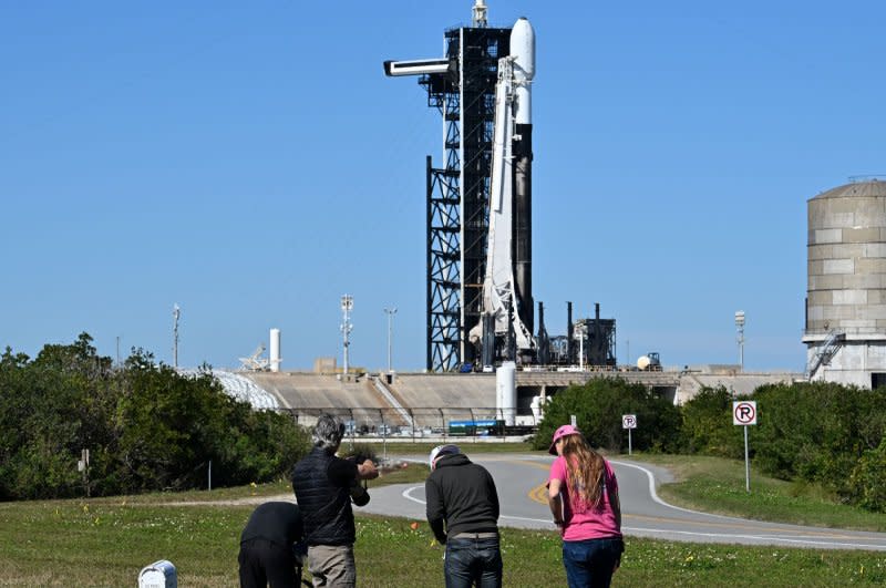Photographers reset remote cameras to cover the launch of the SpaceX Falcon 9 rocket carrying the Intuitive Machines' IM-1 on Complex 39A at the Kennedy Space Center on Wednesday. The launch has been rescheduled for early Thursday morning after experiencing issues with fuel temperatures on the initial countdown. Photo by Joe Marino/UPI