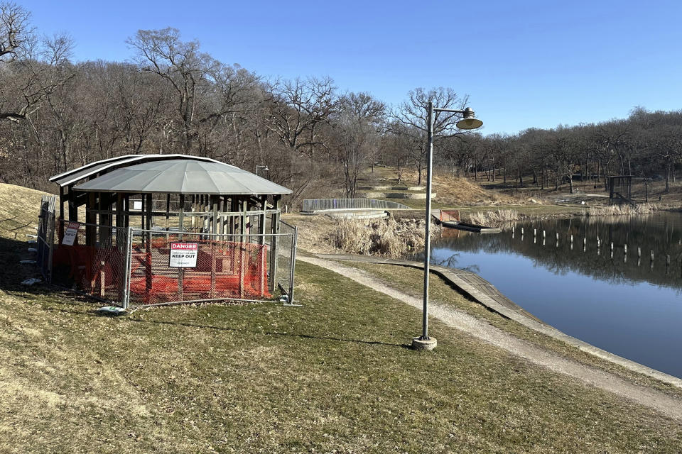 Part of an artwork, called Greenwood Pond: Double Site, is shown Sunday, Feb. 25, 2024, in Des Moines, Iowa. The Des Moines Arts Center plans to rip out the roughly 30-year-old artwork that lines a pond in a historic city park. The decision to remove the work, made up of a series of walkways, shelters and viewing sites, has outraged arts advocates nationally and surprised local residents. (AP Photo/Scott McFetridge)