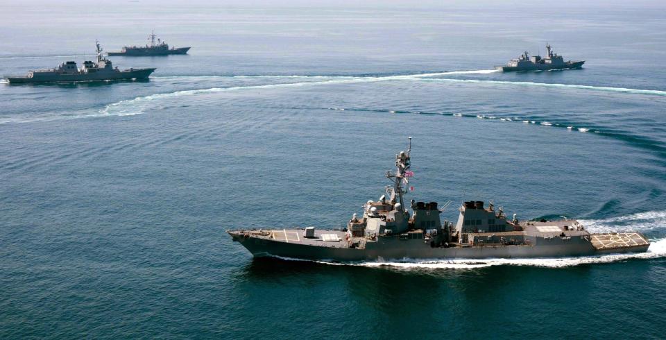 US Navy vessels shown sailing within 12 nautical miles of Subi Reef in the Spratly archipelago in 2015. Source: AAP