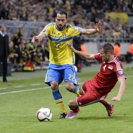 Sweden's Erkan Zengin (L) fights for the ball with Liechtenstein's Daniel Kaufmann during their Euro 2016 qualifying soccer match in Stockholm October 12, 2014. REUTERS/Maja Suslin/TT News Agency