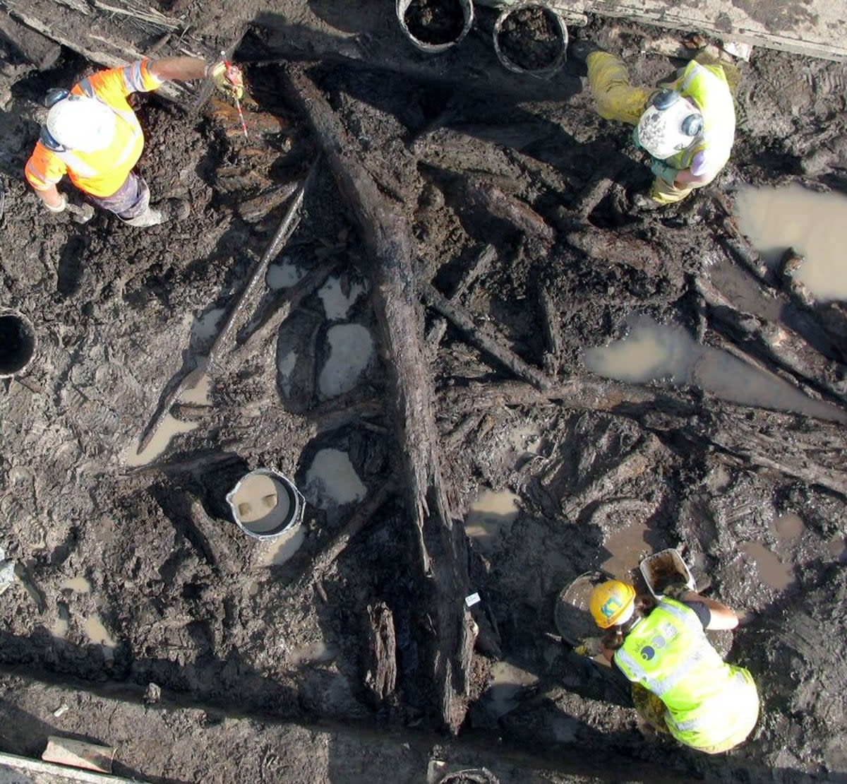 The Oxford Archaeology team excavating the wooden objects exceptionally preserved in waterlogged soil at Stainton West near Carlisle. These objects date to the Mesolithic and Neolithic - and their level of preservation is very rare. (Image owned by Oxford Archaeology)