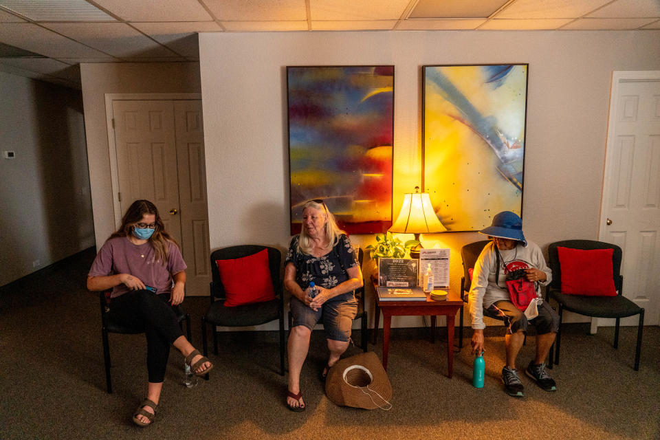 Katherine Cuendet, left, intern at the Arizona Cancer Support Community, Wendy Petransky, 69, center, diagnosed with malignant melanoma but says it's currently not active, and Karen Beeson, 69, right, diagnosed with cancer, rest at the Arizona Cancer Support Community offices after a forest bathing session in Flagstaff on July 21, 2022. Shinrin-yoku, also known as forest bathing, is a Japanese health and wellness practice meant for participants to immerse themselves with the forest atmosphere.