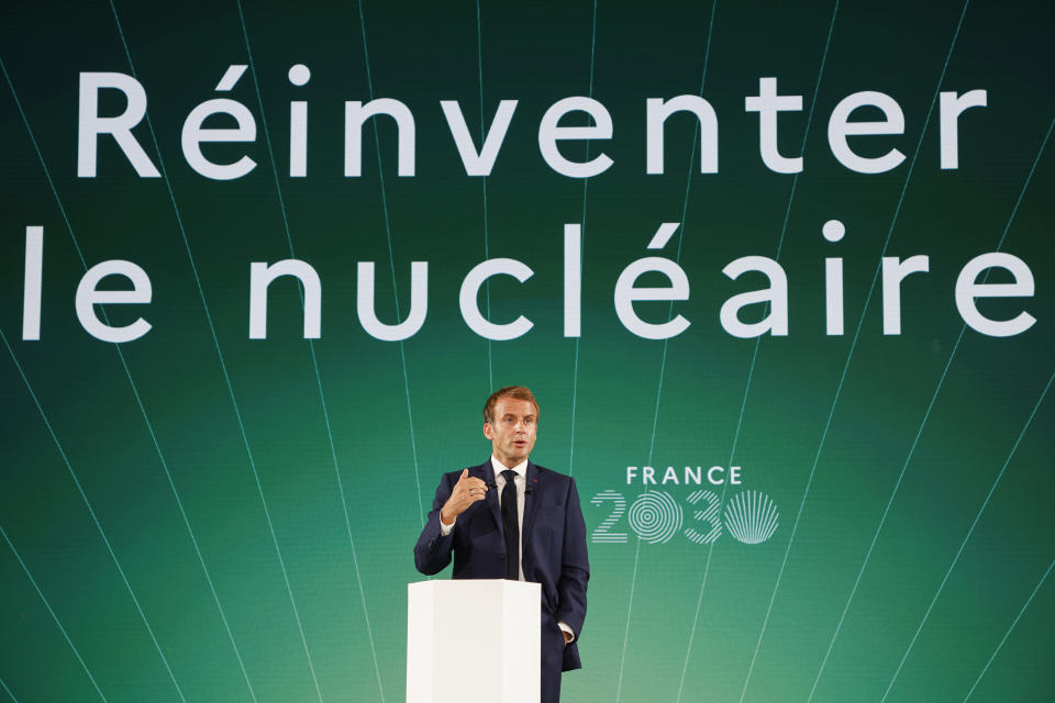 French President Emmanuel Macron speaks during the presentation of "France 2030" investment plan at the Elysee Palace in Paris, Tuesday Oct. 12, 2021.French President Emmanuel Macron details the priority sectors of the "France 2030" plan to "bring out the champions of tomorrow". Behind reads: Reinvent nuclear energy. (Ludovic Marin, Pool Photo via AP)
