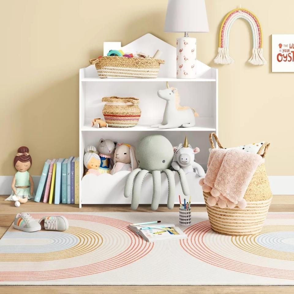 Rainbow-patterned rug in child's room