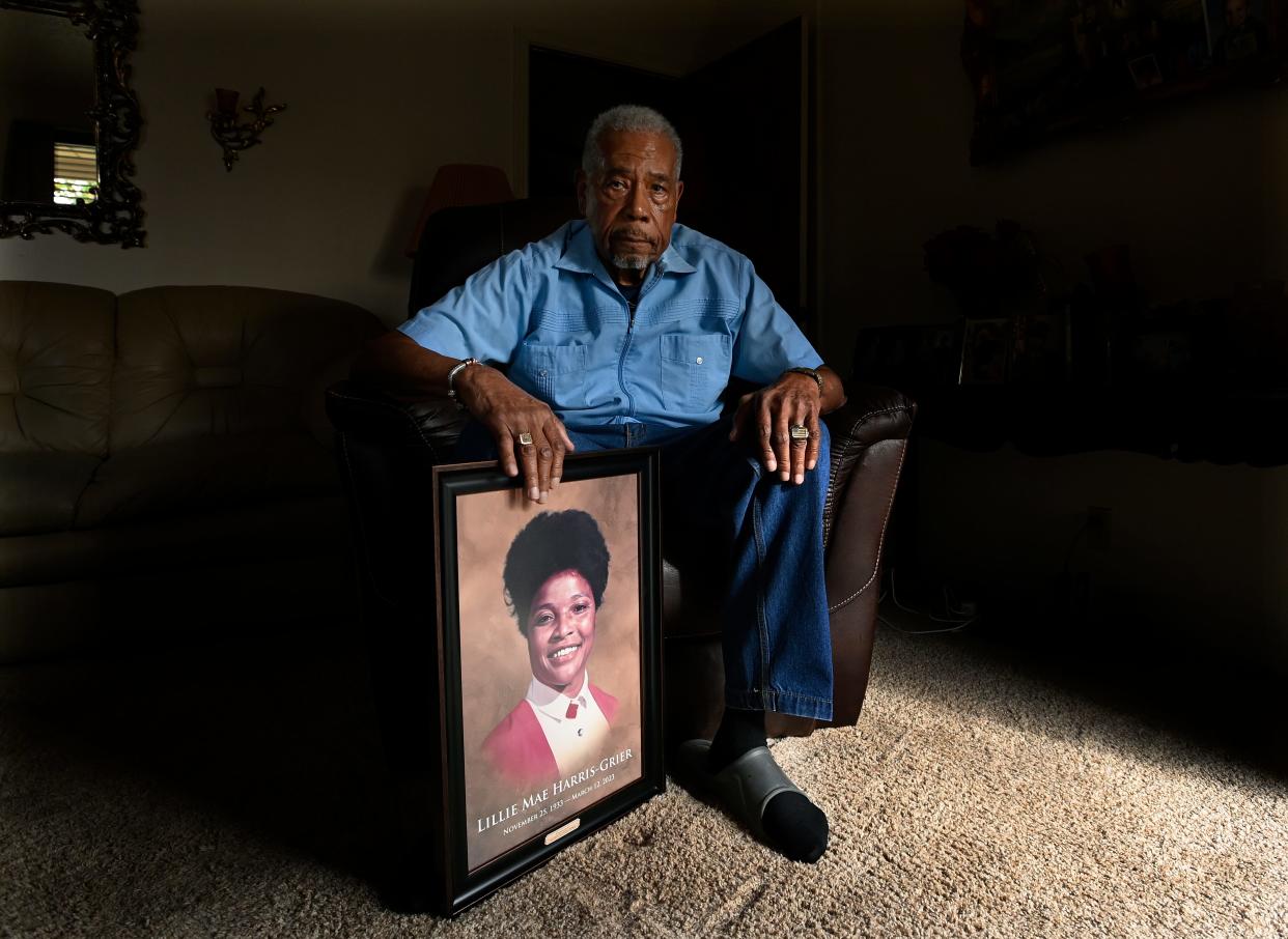 Robert Grier, 86, sits with a 1980s photograph of his wife, Lillie, at his home on Tuesday, Nov. 14, 2023, in Clarksville, Tenn. According to a new lawsuit, she had dementia and died after being sexually assaulted by another resident with a history of sexual assaults.