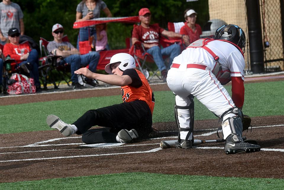 Amanda-Clearcreek senior Cade Young scores an early run for the Aces against Fredericktown. Amanda-Clearcreek baseball fell 5-1 in a Division III District Final at Olentangy Orange High School.