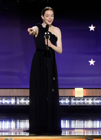 <p>Kevin Winter/Getty </p> Emma Stone accepts the best actress award during the 29th Annual Critics Choice Awards.