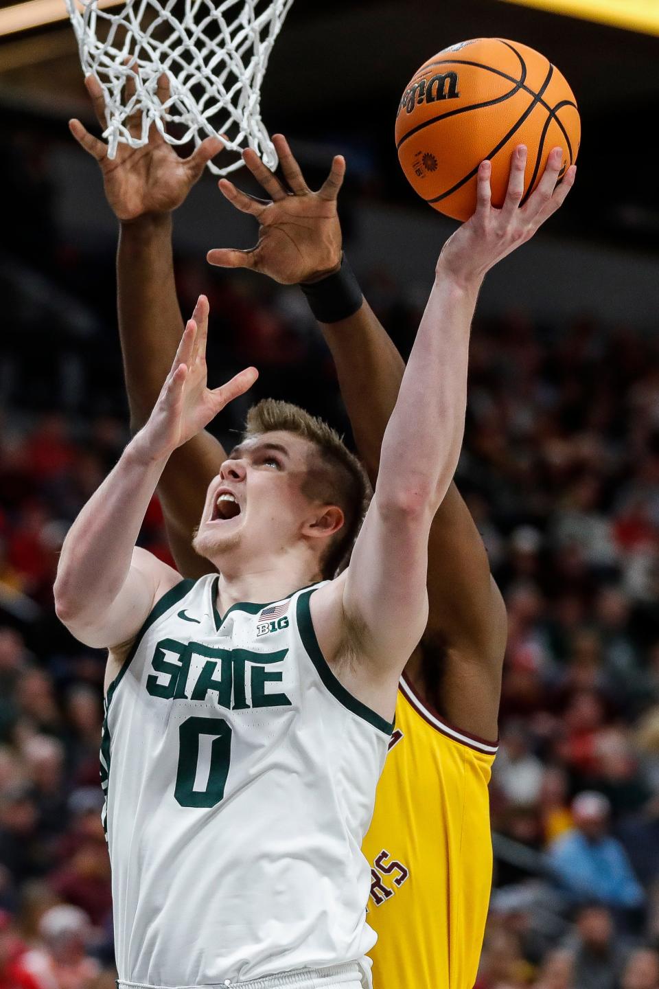Michigan State forward Jaxon Kohler (0) goes to the basket against Minnesota forward Pharrel Payne (21) during the first half of Second Round of Big Ten tournament at Target Center in Minneapolis, Minn. on Thursday, March 14, 2024.