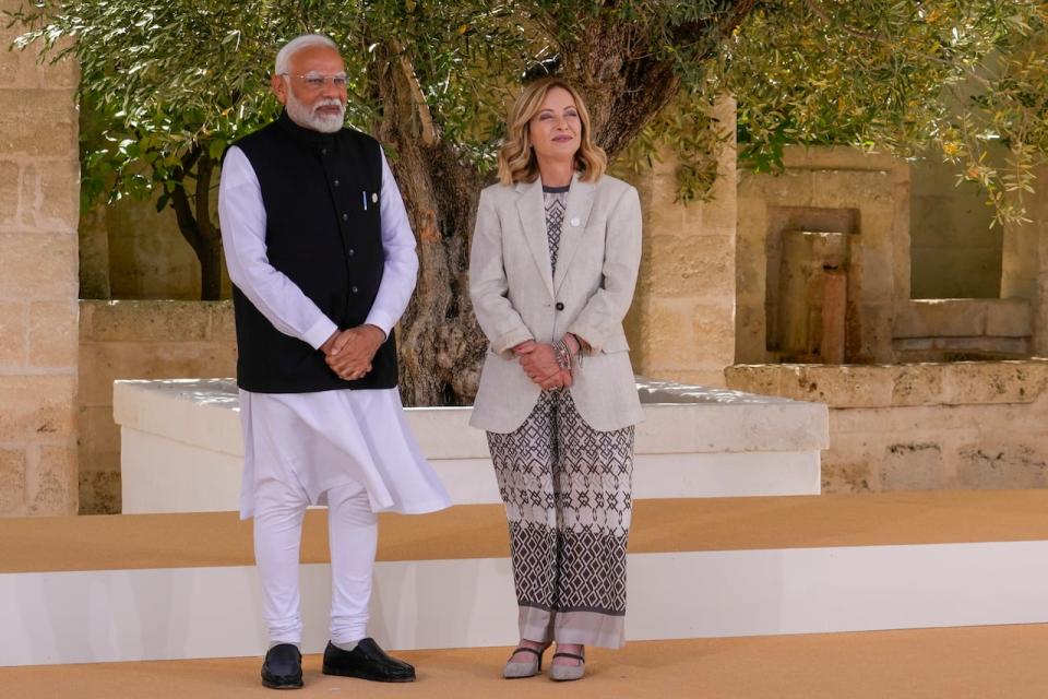 Indian Prime Minister Narendra Modi, left, is welcomed by Italian Prime Minister Giorgia Meloni at the G7 in Borgo Egnazia, near Bari in southern Italy, Friday, June 14, 2024.