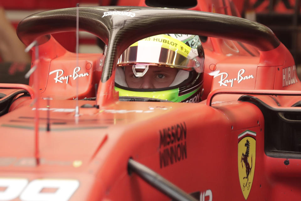 Mick Schumacher prepares for his first F1 test for Ferrari at the Bahrain International Circuit in Sakhir, Bahrain, Tuesday, April 2, 2019. Mick Schumacher has moved closer to emulating his father Michael by driving a Ferrari Formula One car in an official test. Schumacher's father won seven F1 titles, five of those with Ferrari and holds the record for race wins with 91. (AP Photo/Hassan Ammar)