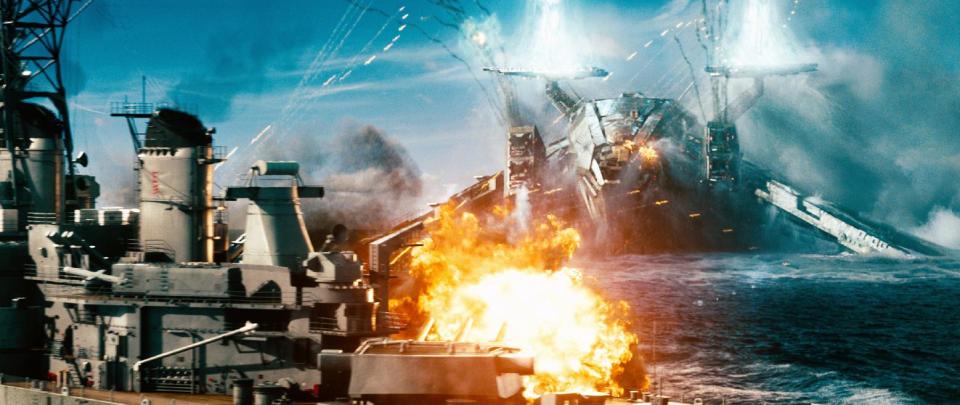 In this film publicity image released by Universal Pictures, a naval ship is attacked by an invader in a scene from "Battleship." “Battleship,” a Universal Pictures movie based on the Hasbro Inc. board game, has survived an armada of tomato-throwing critics and chugged to $170 million in ticket sales overseas. The haul goes part way to justifying the reported $209-million price tag, but after subtracting splits with theater owners, it is estimated to need about half a billion at box offices to turn a profit. With a fleet of other hotly expected blockbusters surrounding its U.S. release on May 18, the tides need to be solidly in its favor to stay above water. (AP Photo/Universal Pictures)