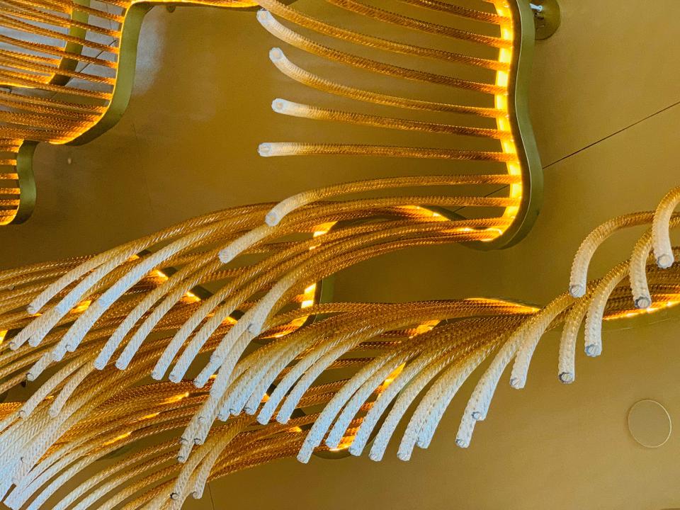 Light fixture that looks like pasta noodles on ceiling