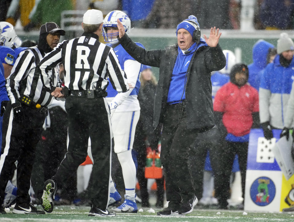 Air Force head coach Troy Calhoun, front right, argues for a call with referees in the first half of an NCAA college football game against Colorado State, Saturday, Oct. 28, 2023, in Fort Collins, Colo. (AP Photo/David Zalubowski)