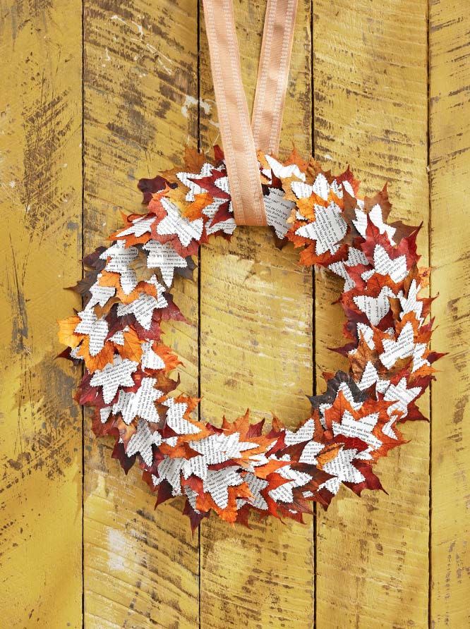 <p>A paper wreath is an incredibly lovely addition to any front door. With leaf shapes galore, this one's perfectly seasonal too.<strong><br></strong></p><p><strong>Make the wreath:</strong> Draw a 3-inch-wide maple leaf shape on a piece of cardboard and cut out to create a stencil. Trace on original pages (or, preferred, photocopied pages) of a vintage book—consider a fall-themed title or mystery novel—and cut out approximately 100 leaves with decorative scissors that have a "torn paper" edge. Attach book page leaves to maple leaves with hot glue. Attach layered leaves to a 16-inch wreath form with hot glue, layering and overlapping them as you go. Hang with burlap ribbon.</p>