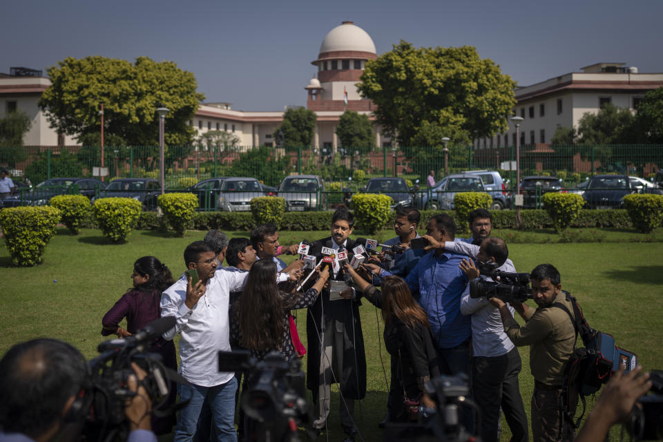 Aftab Ali Khan, a lawyer representing one of the petitioners briefs media persons at the Supreme Court premises in New Delhi, India, Thursday, Oct. 13, 2022. Two judges of India's top court on Thursday differed on a ban on the wearing of the Muslim headscarf ''Hijab'' in educational institutions in southern Karnataka state and referred the issue to a larger bench of three or more judges to settle the issue. (AP Photo/Altaf Qadri)