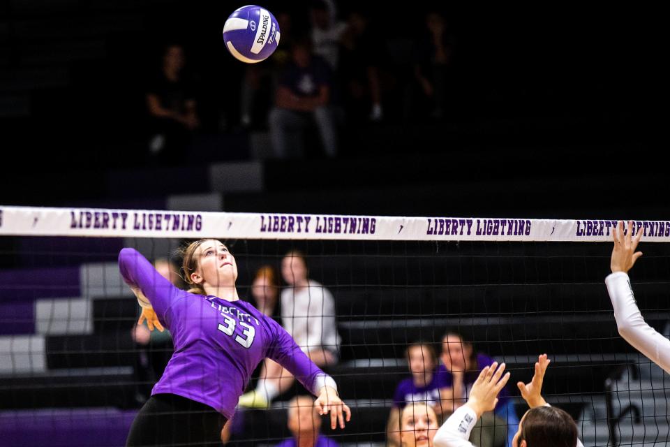 Iowa City Liberty's Cassidy Hartman goes up for an attack against Western Dubuque on Tuesday at Liberty High School.