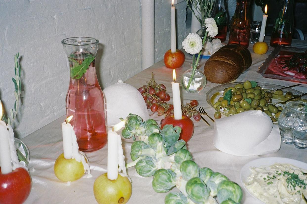 a table with food and candles