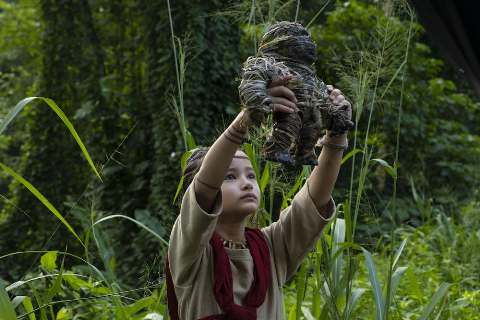 Jai (Kaylee Hottle) reaches out in Godzilla vs. Kong. (PHOTO: Warner Bros Pictures)