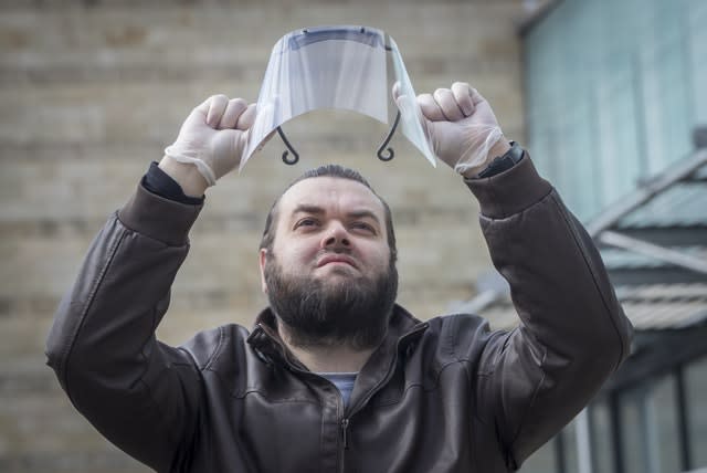 Sid Lovatt with his 3D-printed protective mask that he has been supplying to frontline workers