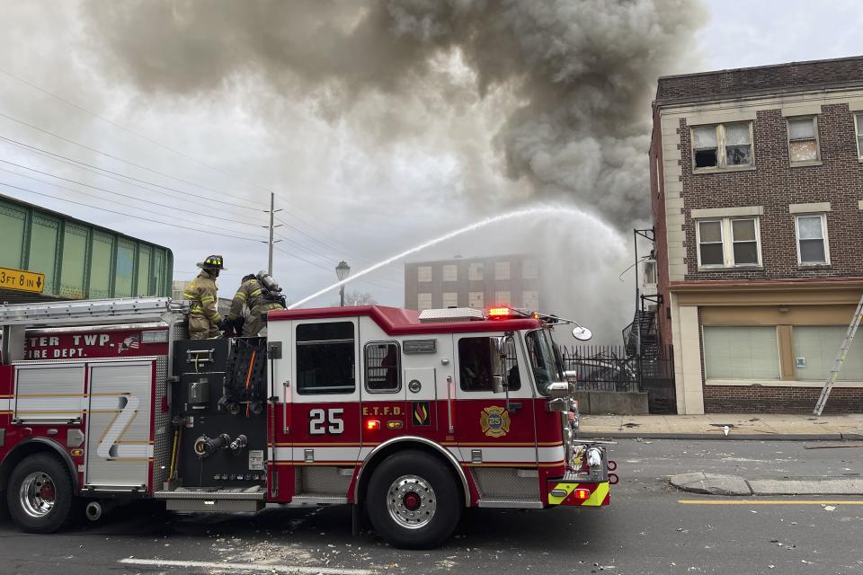 Emergency personnel work at the site of a deadly explosion at a chocolate factory in West Reading, Pa., Friday, March 24, 2023. ( Ben Hasty /Reading Eagle via AP)