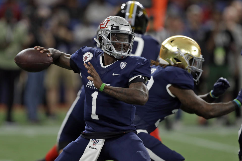 West quarterback Tyler Huntley, of Utah, throws a pass against the East during the first half of the East West Shrine football game Saturday, Jan. 18, 2020, in St. Petersburg, Fla. (AP Photo/Chris O'Meara)