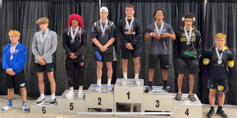 Mariner's Hansel Pompa-Mauri poses after coming in third in the Class 2A 152-pound class at the FHSAA state tournament on March 4, 2023.
