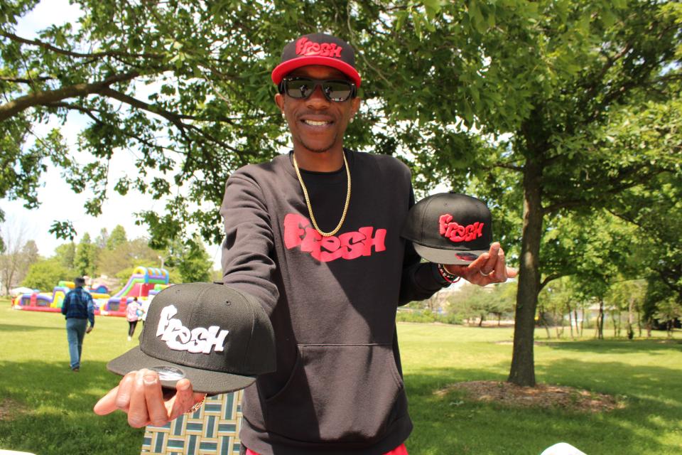 Malik Lynch, owner of Fresh Prints of Green Bay, was one of the many vendors and sponsors at the 3rd annual Juneteenth celebration organized by We All Rise and Black Lives United at Joannes Park on Saturday in Green Bay.