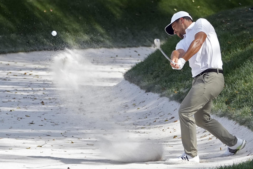 Xander Schauffele hits from the sand trap on the ninth hole during the second round of The Players Championship golf tournament Friday, March 15, 2024, in Ponte Vedra Beach, Fla. (AP Photo/Marta Lavandier)