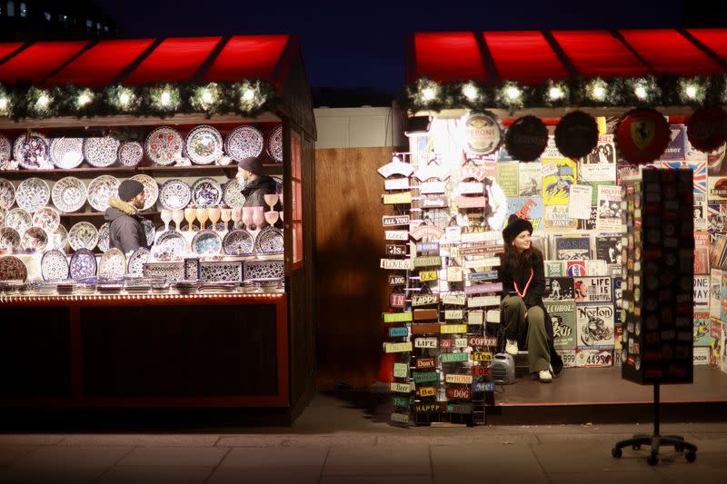 People visit a Christmas market in London