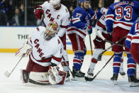 Carolina Hurricanes goaltender Antti Raanta (32) reacts after giving up a goal to New York Rangers center Mika Zibanejad (93) in the second period of Game 4 of an NHL hockey Stanley Cup second-round playoff series, Tuesday, May 24, 2022, in New York. (AP Photo/John Minchillo)