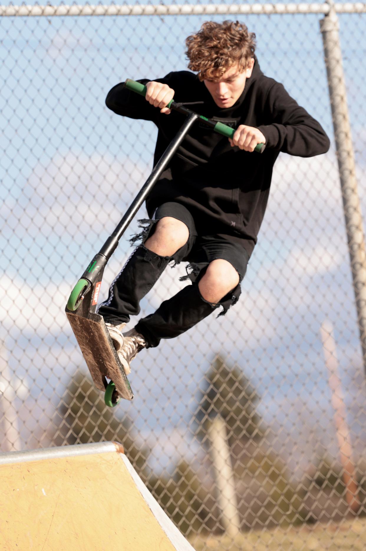 Shawn White, 14, of Canton, performs a jump at the Canton DIY Skatepark.