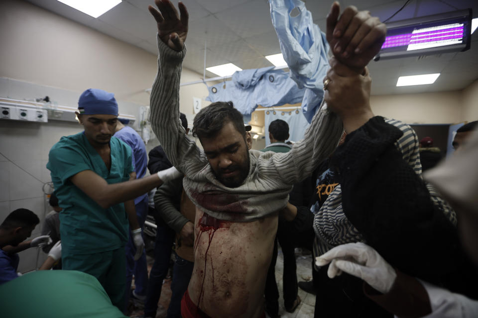 A Palestinian man wounded in the Israeli bombardment of the Gaza Strip receives treatment at the Nasser hospital in Khan Younis, Southern Gaza Strip, Monday, Jan. 22, 2024. (AP Photo/Mohammed Dahman)