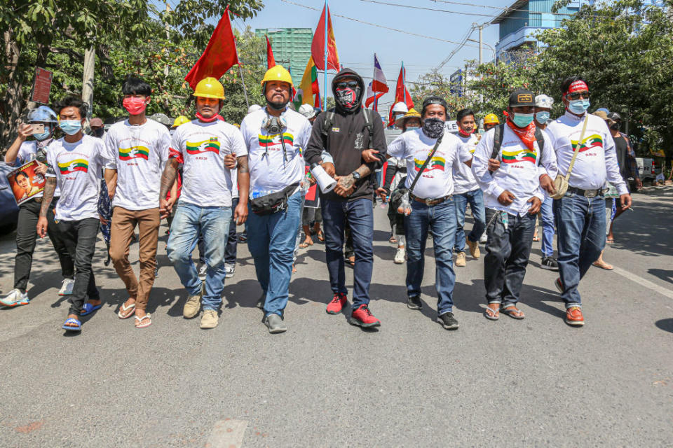 Protesters from all Burma Federation of Youth unions march ahead of other protesters during the military coup protest in Mandalay on Feb. 24, 2021.<span class="copyright">Kaung Zaw Hein/SOPA Images/LightRocket via Getty Images</span>