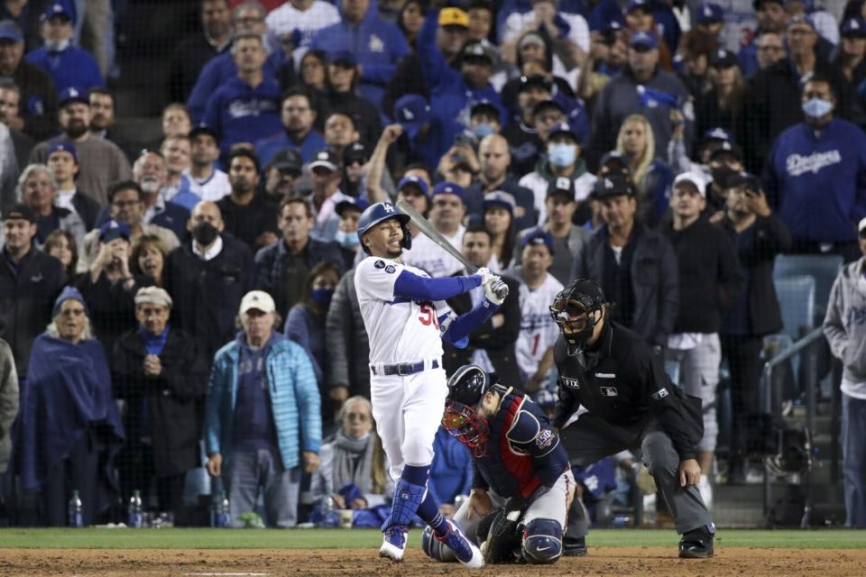 Dodgers' Mookie Betts strikes out during the eighth inning.