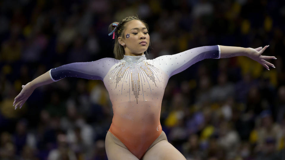 Auburn gymnast Sunisa Lee, the 2020 Tokyo Olympics all-around champion, performs on the balance beam during an NCAA gymnastics meet against LSU on Saturday, Feb. 5, 2022, in Baton Rouge, La. (AP Photo/Matthew Hinton)