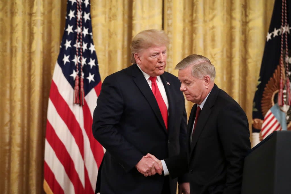 Senator Lindsey Graham, R-S.C., right, was one of many Republicans who defended Donald Trump over his comments to journalist Bob Woodward. (Getty Images)