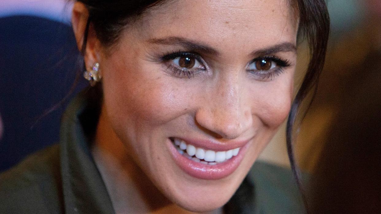 Meghan Markle, Duchess of Sussex, smiles during a reception hosted by the Governor General at Admiralty House in Sydney on October 16, 2018.